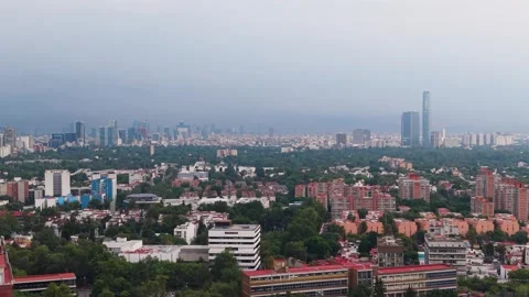 Drone view of dense southern Mexico City on a hazy day Stock Footage 338088096