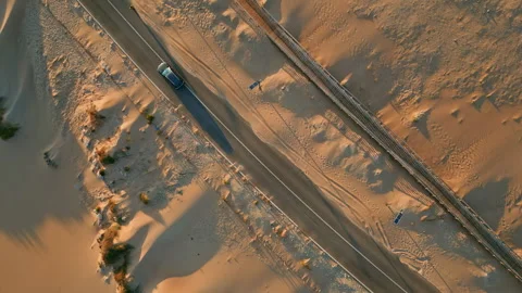 Drone view desert highway running along sandy terrain summer. Transport riding Video stock 260746884