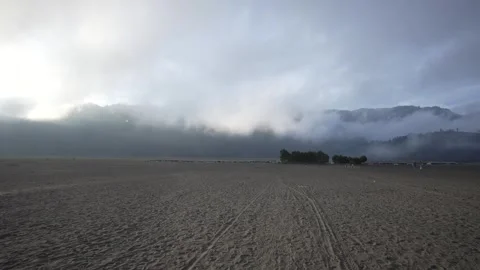 A drone view of the desert near the active Bromo volcano Stock Footage 258313785