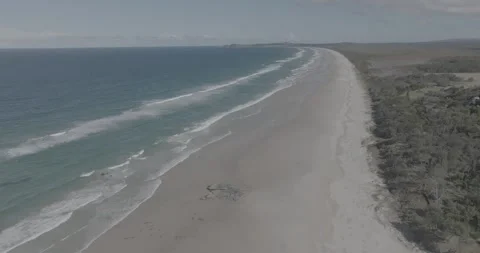 Drone view of deserted beach in Byron Bay, Australia Stock Footage 264770286