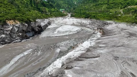 Drone view of a devastated Himalayan riverbed carved by intense flash floods Stockbeeldmateriaal 345276779