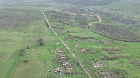 Drone View: Devastated Village Road and Ruined Homes in War Zone Stockbeeldmateriaal 332356733