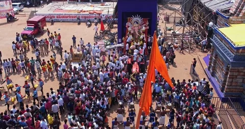 Drone View of Devotees Playing Drums Before Lord Ganesha During Immersion Stock Footage 340084052
