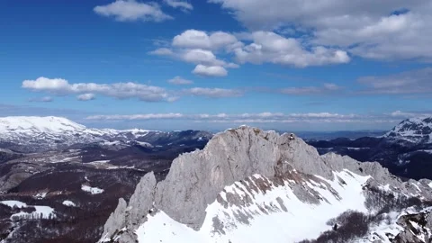 Drone view of difficult access mountain peak for climbers during a winter Stock Footage 171557394