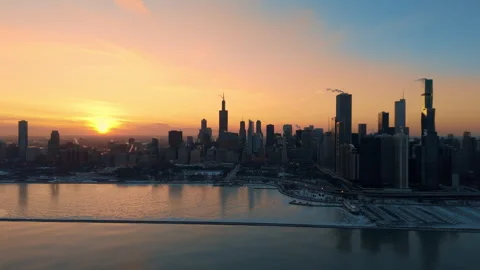 Drone view of downtown Chicago skyline at sunset during winter. The surface of Stock Footage 327892038