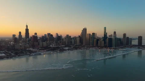 Drone view of downtown Chicago skyline at sunset during winter. Ice formations Stock Footage 327918035