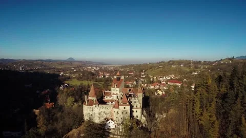 Drone view of Dracula Castle on a bright autumn day directly above Stock Footage 233687866