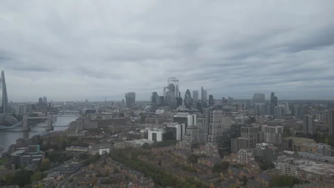 A drone view of the dramatic London cityscape under a cloudy sky.  Stock Footage 289390491