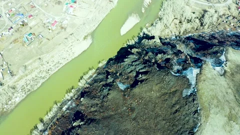 Drone view of a dried-up riverbed in the mountains. Yellow grass and big rocks.  스톡 동영상 240528422