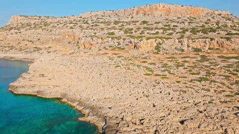 Drone view of the dry rocky plateau at Cape Cavo Greco, Cyprus. Stock Footage 341543438