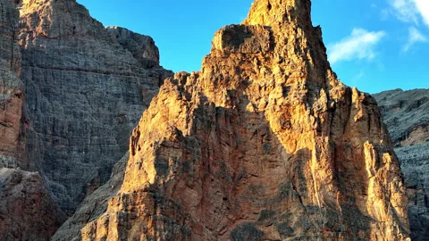 Drone view during sunset of the golden peak of dolomites Video stock 263266704