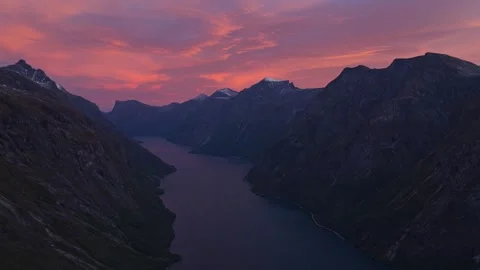 Drone view of Eikesdalsvatnet lake surrounded by rugged peaks in Norway Stock Footage 320429911