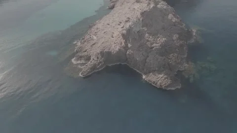 Drone view of the elephant rock formation in Cala Morell, Menorca - D Log Stock Footage 246535619