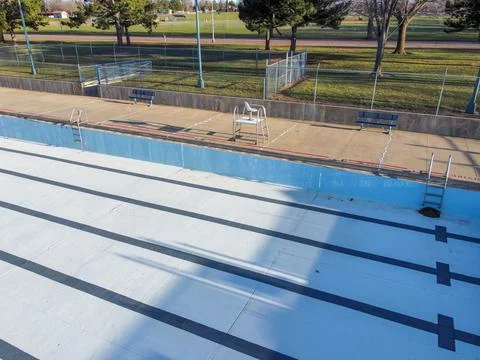 Drone view of an empty and drained winterized swimming pool Stock Photos