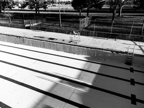 Drone view of an empty and drained winterized swimming pool Stock Photos