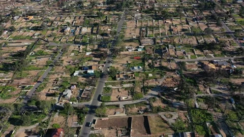 Drone view of empty lots of homes left behind from the Eaton fire Video stock 327882265