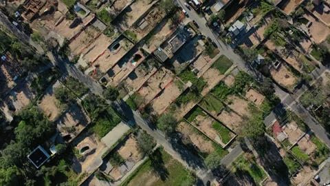 Drone view of empty lots of homes left behind from the Eaton fire Stock Footage 327882298