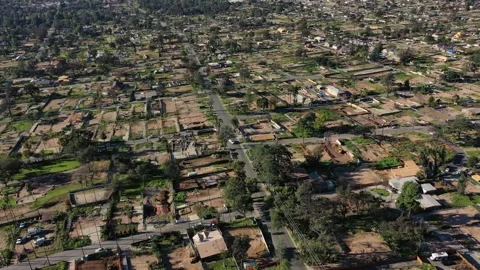Drone view of empty lots of homes left behind from the Eaton fire Video stock 327882392