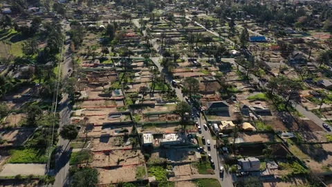 Drone view of empty lots of homes left behind from the Eaton fire Stock Footage 327882417