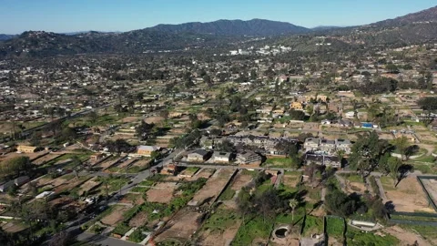 Drone view of empty lots of homes left behind from the Eaton fire Stock Footage 328063346
