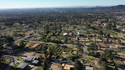 Drone view of empty lots of homes left behind from the Eaton fire Stock Footage 328063665