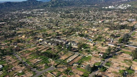 Drone view of empty lots of homes left behind from the Eaton fire Stock Footage 328063945