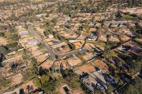 Drone view of empty lots of homes left behind from the Eaton fire Stock Photos