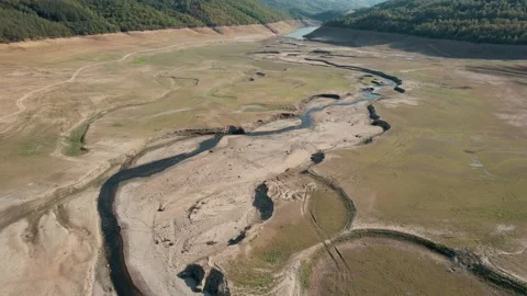 Drone view of empty paths in surface of dry lake. 4K Video Stock Footage 166107669
