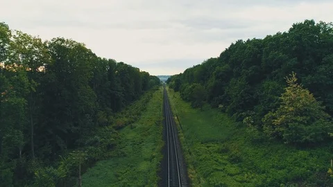 Drone view of empty straight single-way railways sunny summer day. 4K. Stock Footage 110713922