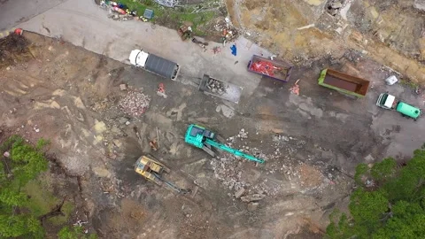 Drone View of Excavator Loading Rubble into Dump Truck at Construction Site Stock Footage 309432890
