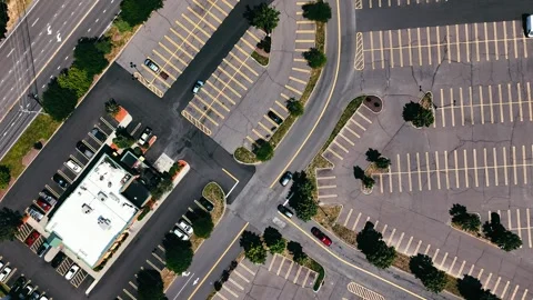 Drone view of an expansive parking lot with rows of parked cars... Vídeo Stock 340657931