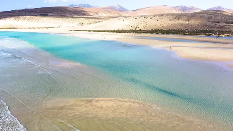 Drone view of exposed sand at low tide at Sotavento Beach. Stock Footage 284390634