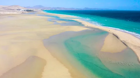 Drone view of exposed sand at low tide at Sotavento Beach. Stock Footage 284391134