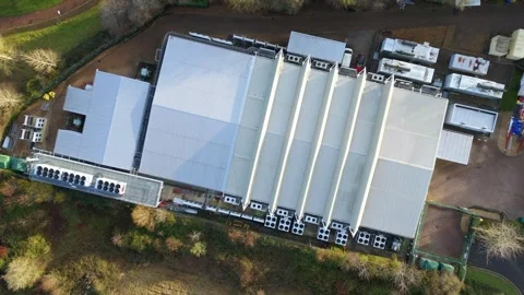 Drone view of the external power and cooling components of a massive British AI Stock Footage 333021220