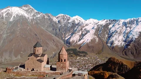 Drone view of famous Gergeti Trinity Tsminda Sameba Church Stock Footage 224920248