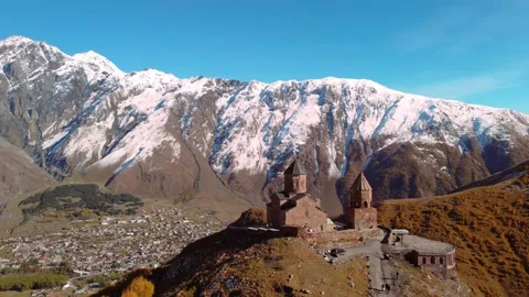 Drone view of famous Gergeti Trinity Tsminda Sameba Church Stock Footage 224920604