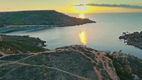 Drone view of famous sunset point. Ghain Tuffieha beach, Malta Stock Footage 323854669