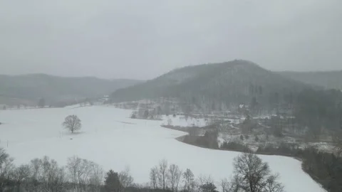Drone view of farm fields in valley with snow in Wisconsin. Stock Footage 166260635
