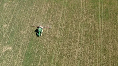 Drone view of a farm tractor spraying fields in Spain (1) Stock Footage 112241879