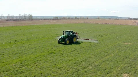 Drone view of a farm tractor spraying fields in Spain (2) Stock Footage 112242077