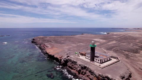 Drone View of Faro Punta de Jandia and Rugged Coastline in Fuerteventura Stock Footage 309694775