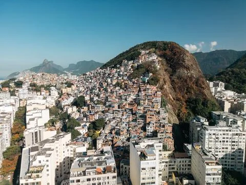 Drone view of favela on mountain behind Copacabana Beach in Rio de Janeiro Stock Photos