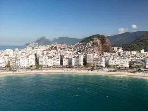 Drone view of favela on mountain behind Copacabana Beach in Rio de Janeiro Stock Photos