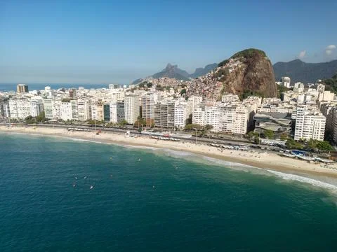 Drone view of favela on mountain behind Copacabana Beach in Rio de Janeiro Stock Photos