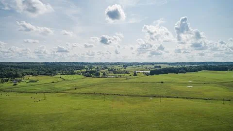 Drone view of fields, forests and sky. Stock Photos