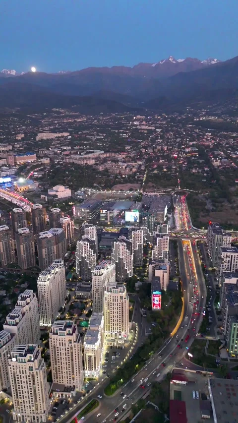 Drone view of financial district at dusk with moon Stock Footage 345601406