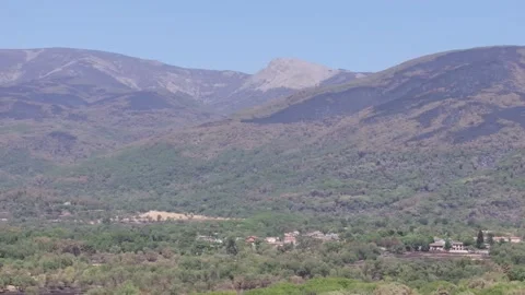 Drone view of fire-scorched mountains and islands of green forest in La Adrada. Stock Footage 346213872