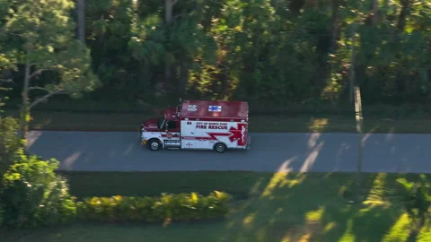 Drone view of fire truck responding to emergency on Florida roadway, showing Stock Footage 317104489