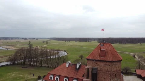 Drone view of a flag looming on top of the fortress Stock Footage 167691598