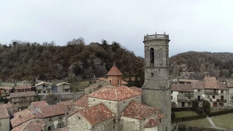 Drone view of flight between a bell tower and a church Stock Footage 102215192
